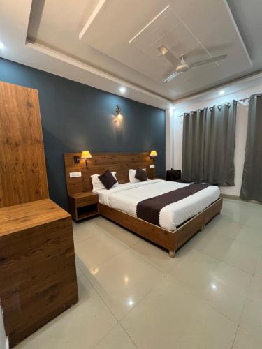 a bedroom with a large bed in a room at Haven On Hill - Rishikesh in Rishīkesh