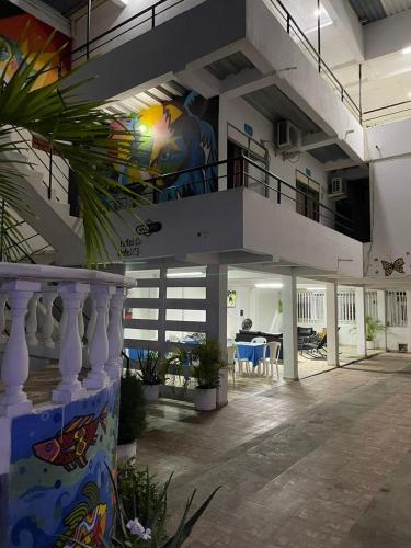 a large building with a staircase with a balcony at Hotel donde Tito in Tolú
