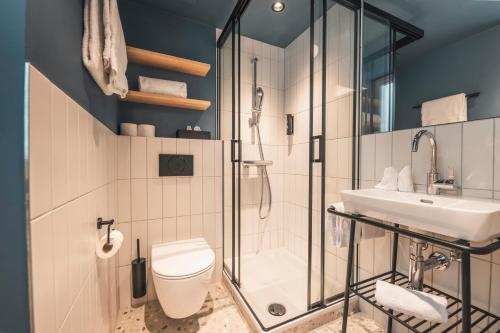 Ванная комната в HOP Apartments & Suites