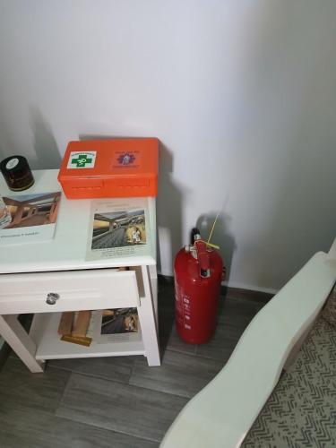 a small table with a red box on top of it at Villa Christoforos Kekakos Magical View in Neapolis