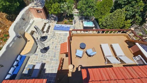 an overhead view of a house with chairs and a swimming pool at Old Town Pearl in Rhodes Town