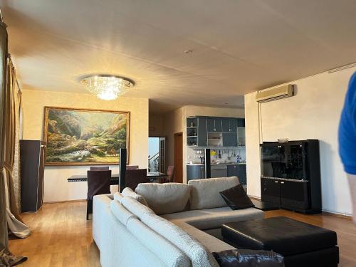 a living room with a couch and a table at Caspian in Baku