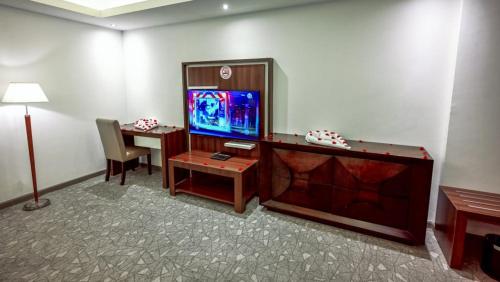 TV o dispositivi per l'intrattenimento presso Helat Hotel