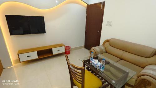 a living room with a couch and a table at The Castle Inn in Dhaka
