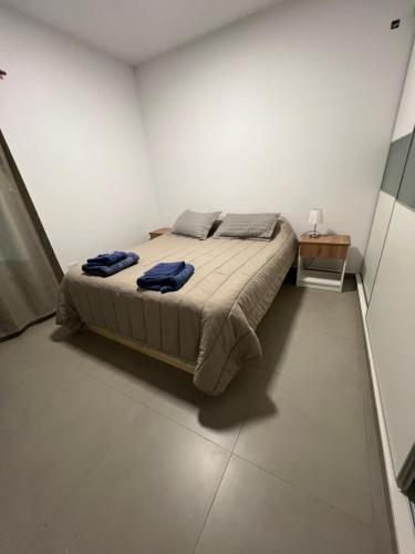 a bedroom with a bed in a white room at Sol y olas in Playa Unión