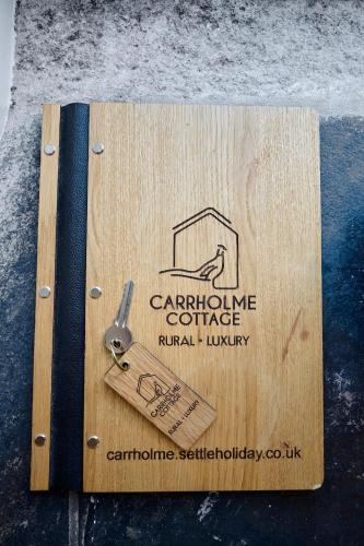 Certifikát, hodnocení, plakát nebo jiný dokument vystavený v ubytování Carrholme Cottage