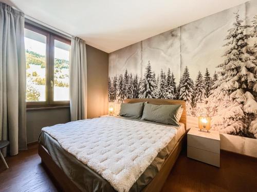 a bedroom with a large bed with a snow covered wall at Maison Poluc - Suite Alpine in Champoluc