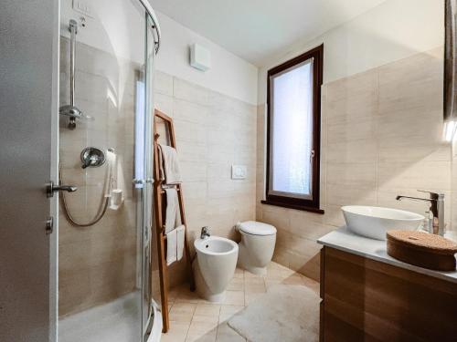a bathroom with a shower and a sink and a toilet at Maison Poluc - Suite Alpine in Champoluc