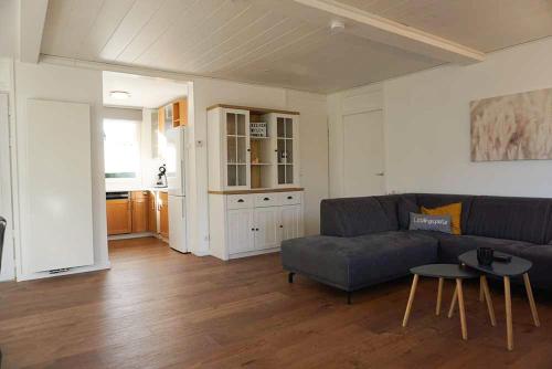 a living room with a couch and a table at Keizerskroon 237 in Julianadorp