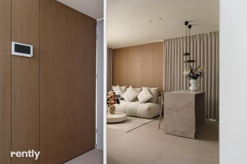 a living room with a couch and a table at Eilat 42-by rently in Eilat