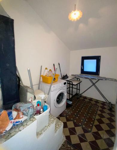 TV a/nebo společenská místnost v ubytování Ame Casa - Accoglienza Diffusa