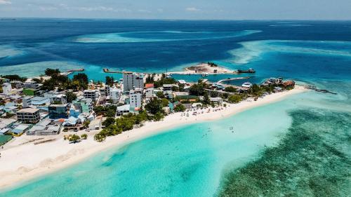 an aerial view of a beach in the ocean at Arrival Beach and Spa in Gulhi