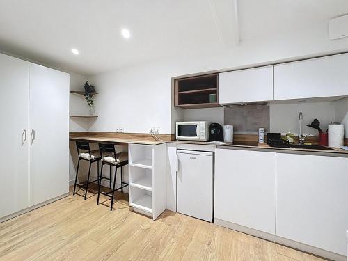 Kuchyň nebo kuchyňský kout v ubytování Studio coeur centre ville N1