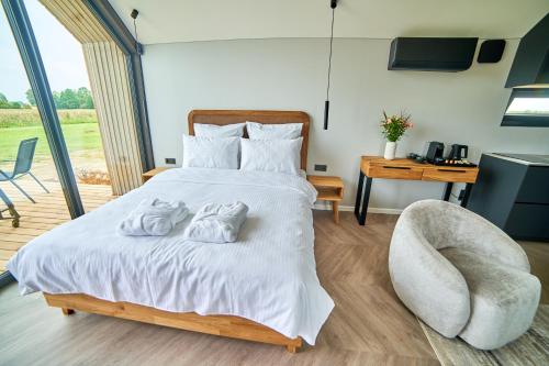 Postel nebo postele na pokoji v ubytování Oriana Resort