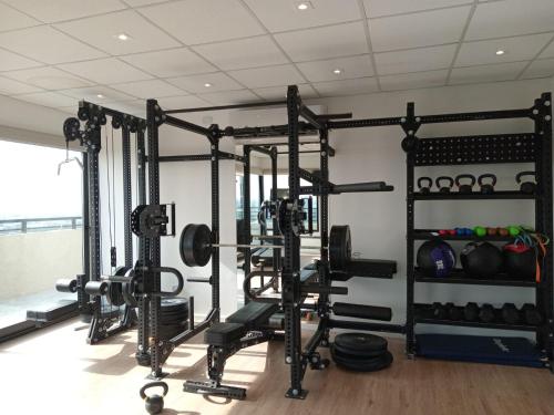 a gym with lots of equipment in a room at Torres Brickell Departamento -MALVAN- 1A in Tigre