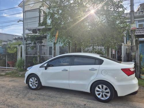 a white car parked in front of a house at Homstay Tố Như in Ấp Bình Thới