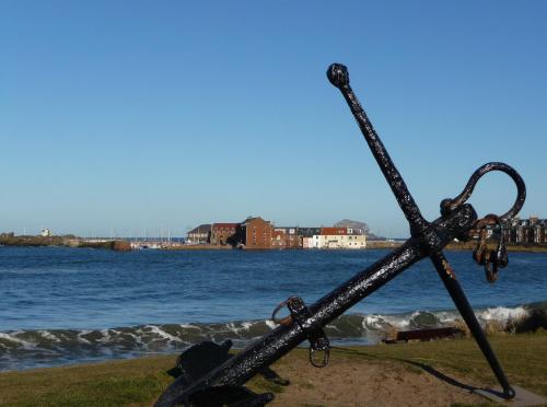 a couple of metal instruments sitting on the beach at Coastal Escape 3 Bed Apartment Near the Beach in North Berwick