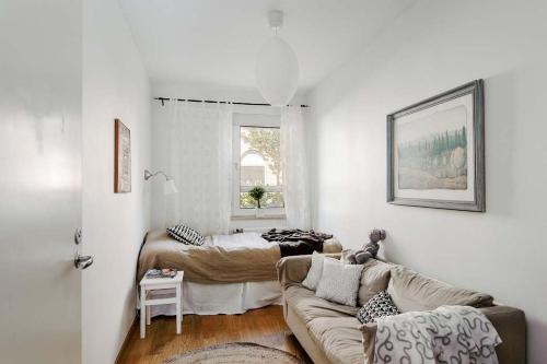 a living room with a couch and a table at Spacious Apartment in Sodermalm in Stockholm