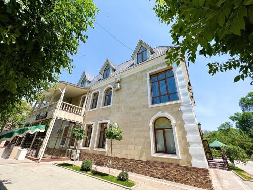 an image of a house at Promenade Park Hotel in Shymkent