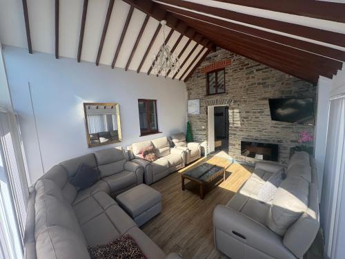 an overhead view of a living room with a couch and a fireplace at The Dairy in Aberystwyth
