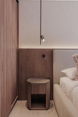 a bedroom with a table next to a bed at Modern & Elegant Loft in El Poblado in Medellín