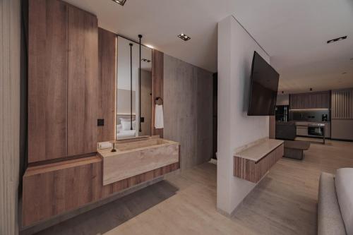 a large bathroom with a tub and a television at Modern & Elegant Loft in El Poblado in Medellín