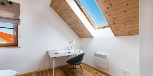 a room with a desk and a window at Kaszubska ostoja- 4 pory roku in Barkocin