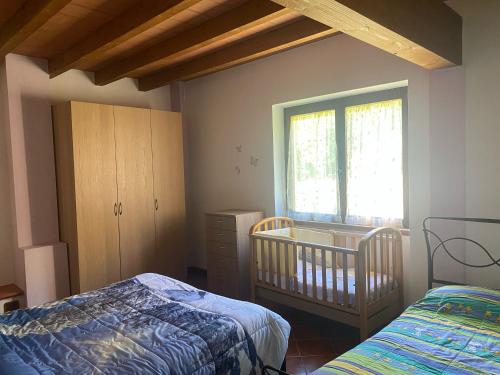 Ein Bett oder Betten in einem Zimmer der Unterkunft Cascina Bruna, un paradiso in Val Trebbia