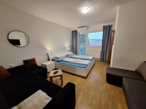 Postel nebo postele na pokoji v ubytování Apartmány EMMA