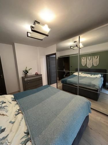 a bedroom with a bed and a large mirror at Garden Spot and Parking in Krakow