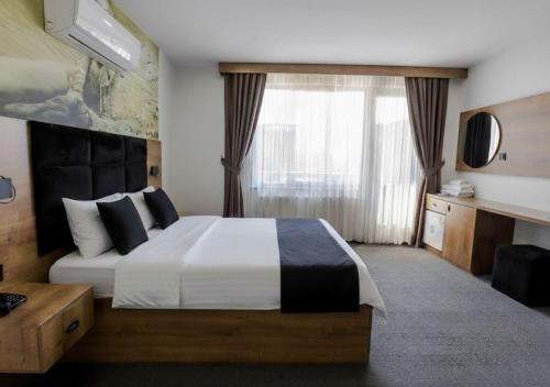 Ένα ή περισσότερα κρεβάτια σε δωμάτιο στο Acar Airport Hotel