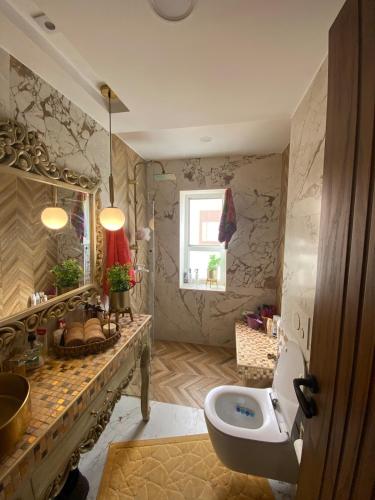a bathroom with a sink and a toilet at Fort View Apartment in Kelibia
