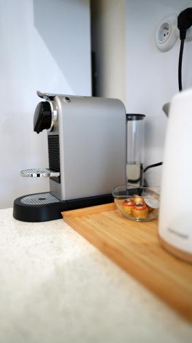 a food processor sitting on a counter with a bowl of food at Apartmán v srdci Olomouce in Olomouc