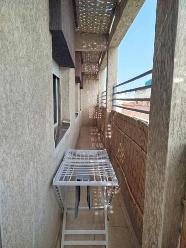 a empty room with a table on the side of a building at A nice appartement a louer temara in Temara