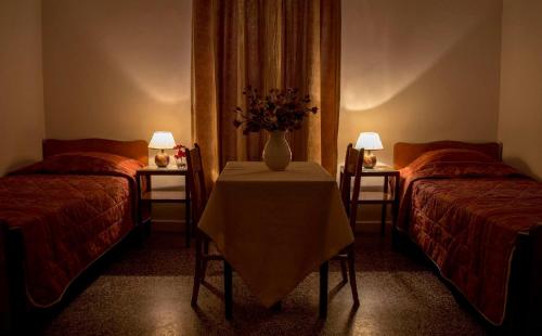 Postel nebo postele na pokoji v ubytování Hotel Oiti