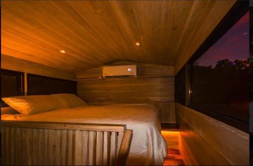 a bedroom with a bed in a small room at Casita VNV in Nosara