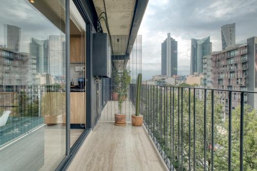 a balcony with a view of a city skyline at Myla Chapultepec in Mexico City