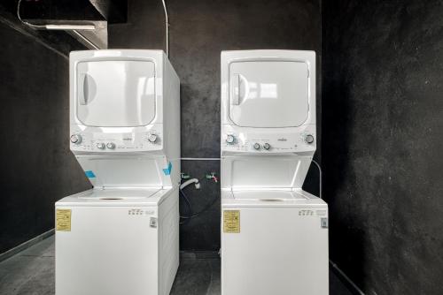 two machines are standing next to each other at Myla Chapultepec in Mexico City