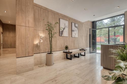 a lobby with wooden walls and a potted plant at Myla Chapultepec in Mexico City