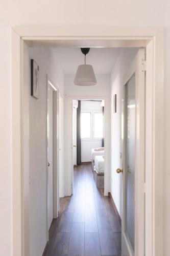 a hallway with a room with a bed at Apartamento Cassa de la selva in Cassà de la Selva