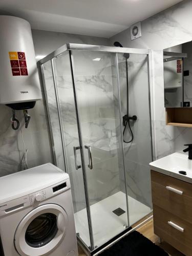 a washing machine in a bathroom with a washer at Studio 200 m from the sea in Aguadulce