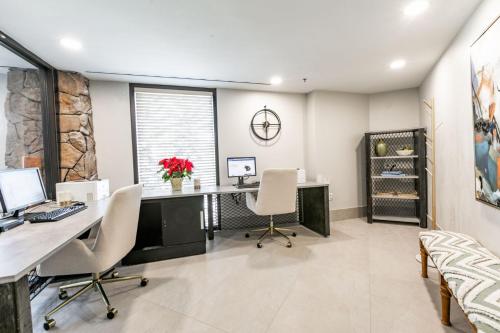 an office with a desk and two chairs and a computer at Condos at Canyons Resort by White Pines in Park City