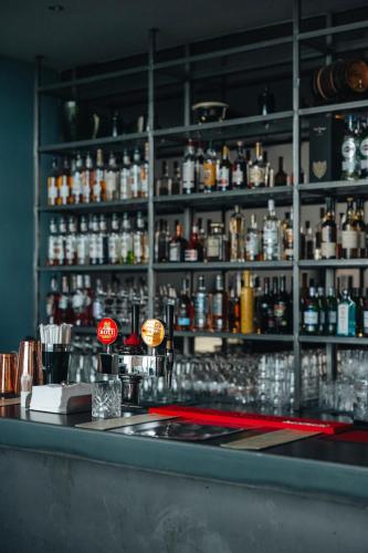 a bar with a lot of bottles of alcohol at Hotel Laki in Kirkjubæjarklaustur
