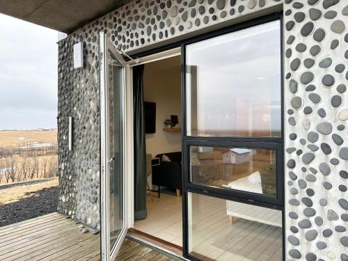 a glass house with a view of the countryside at Hotel Laki in Kirkjubæjarklaustur