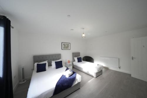 Ealing Broadway Great Stay 7-Minute Walk from the Undergroundにあるベッド