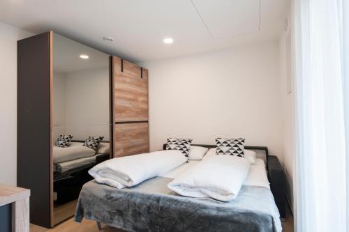 Una cama o camas en una habitación de Armea Appart