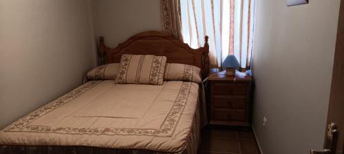 En eller flere senge i et værelse på Alojamientos El Risquillo