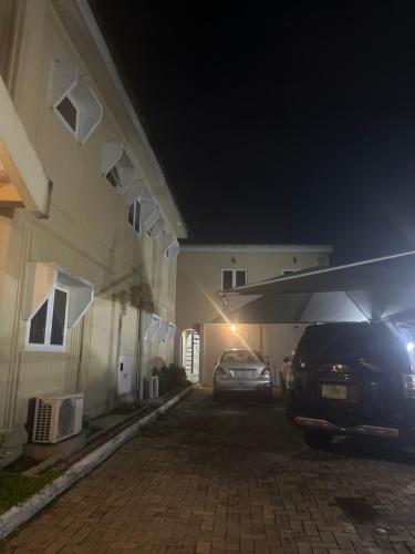 a car parked in front of a house at night at Digi luxury place in Lagos