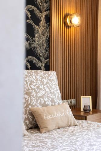 a bedroom with a bed with a pillow on it at Fun and Sun - Appartement de luxe - Dahomey Beach - Bouznika in Bouznika