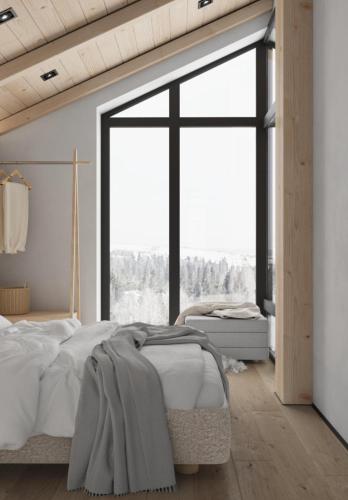 a bedroom with a bed and a large window at be be Chalet mini - privat pool & jacuzi in Bukovel